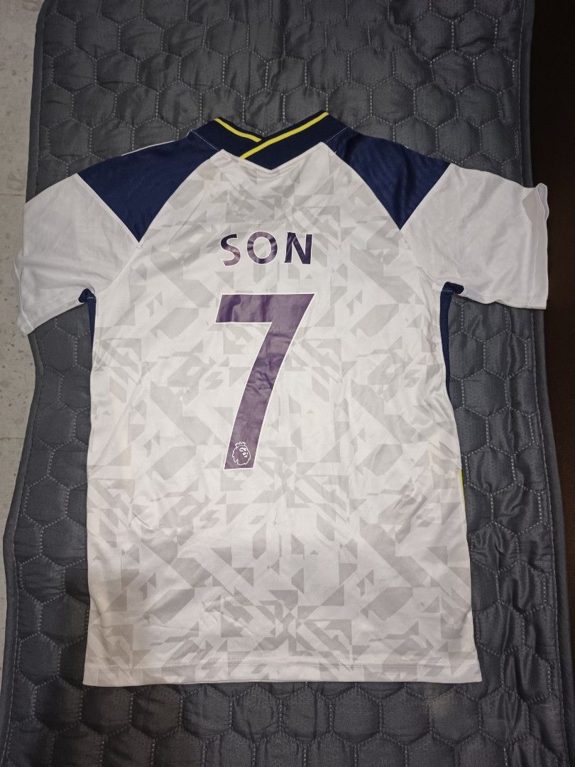 FOOTBALL JERSEY (Category: Activewear) located in Davao. Submitted by jjj_mncd (Listing ID 1463875829, Image 2). Description: - Tottenham Hotspur 21/22 Season Jersey - Size: S - Sponsor: AIA (front) - Player Name/Number: Son 7 (back) - Brand: In-The-Zone - Color: White with navy and yellow accents - Ideal for any dedicated Spurs supporter!.