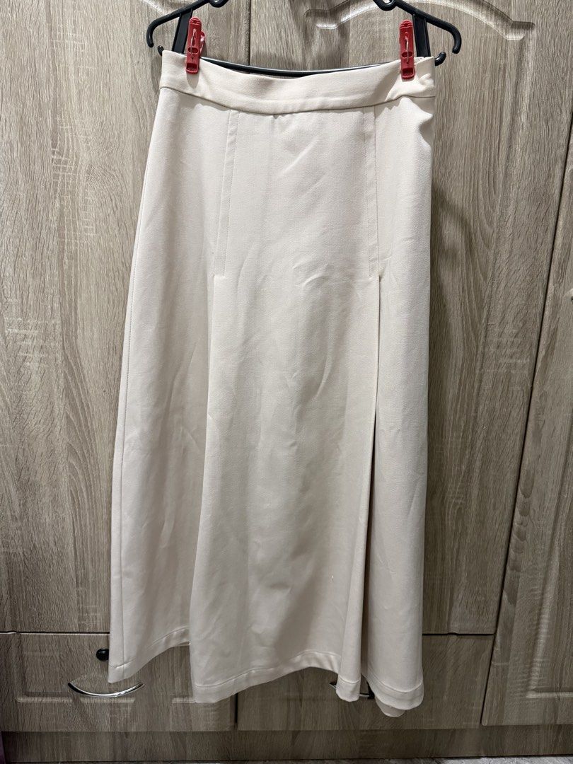 For Me Beige Midi Skirt (Category: Skirts) located in Calamba. Submitted by nicalison (Listing ID 1463831740, Image 1). Description: -can fit 25-26 waist - Brand: For Me - Color: Beige - Size: Extra Small (XS) - Style: Midi skirt - Features: Side slit - Occasion: Suitable for casual or dressy events - Versatility: Easy to pair with various tops.