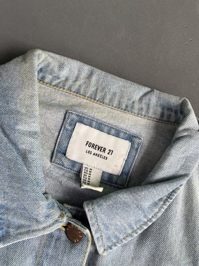 FOREVER 21 DENIM JACKET (Category: Coats, Jackets and Outerwear) located in Quezon City. Submitted by kentstuff (Listing ID 1463858816, Image 3). Description: F21 Size S On Tag Shoulder-Hem : 23.5” Pit-Pit : 19” Condition: Excellent CR: 9.8/10 Flaws: yellow stain Needwash DISCLAIMER: This is a thrifted item. All brands, logos, and trademarks belong to their rightful owners. We’re here to rehome great pieces — no brand affiliation intended..