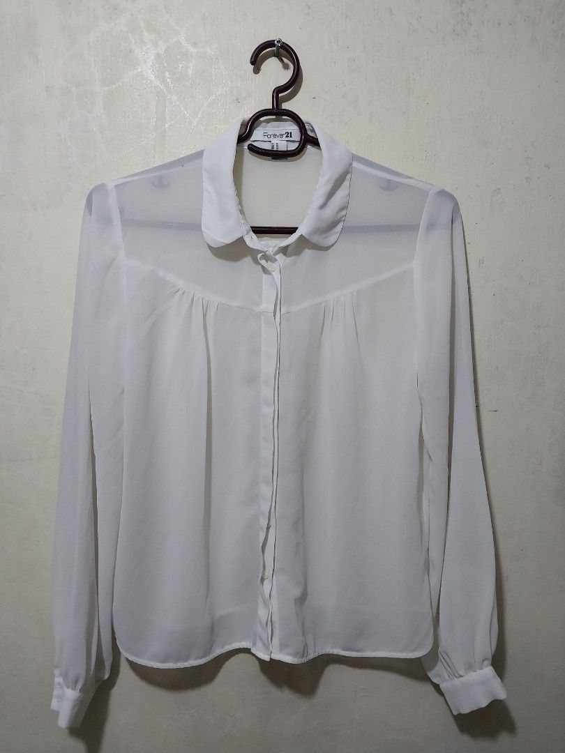 Forever 21 White Sheer Button-Up Blouse (Category: Blouses) located in Manila. Submitted by PrinceDani.Clothing (Listing ID 1463816160, Image 2). Description: f21 white sheer button down polo Medium 21in width 23in length issue: stain excellent condition .