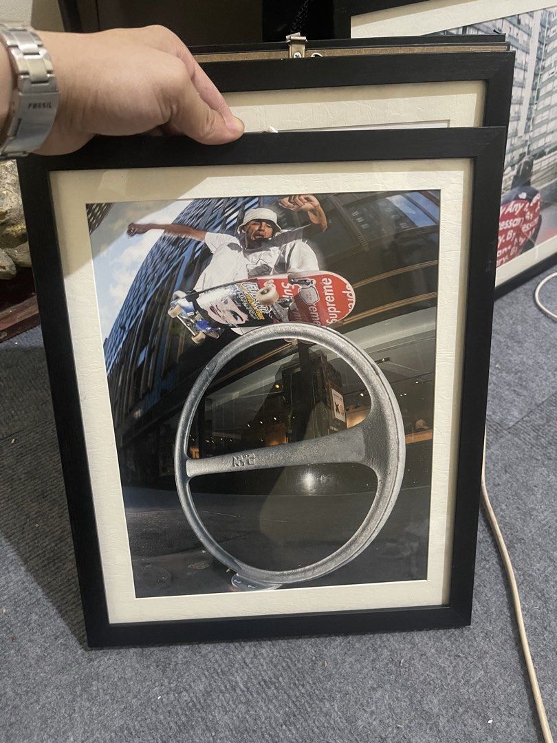 Framed Skateboarder Art Print SUPREME (Category: Frames & Pictures) located in Manila. Submitted by whosnaths (Listing ID 1463844244, Image 1). Description: - Framed print featuring a skateboarder mid-air. - NYC steering wheel in the foreground. - Black frame with a cream mat. - Perfect for any room. - Ready to hang..