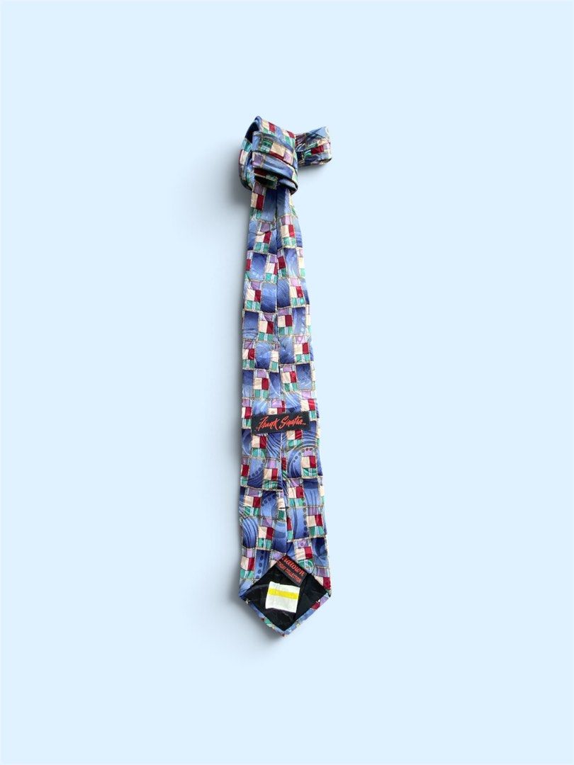 Frank Sinatra Midtown Birthday Collection Tie (Category: Ties) located in Dapitan. Submitted by bolandojh07634 (Listing ID 1463911362, Image 1). Description: - Unique patterned tie featuring a Frank Sinatra label. - Part of the exclusive Midtown Birthday Collection. - Eye-catching pattern with blue, purple, red, and green squares. - Ideal for collectors or adding flair to a special occasion..
