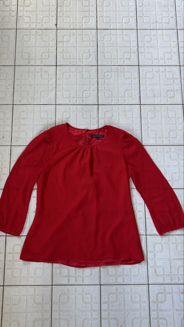 French Connection Red Long Sleeve Blouse (Category: Longsleeves) located in Manila. Submitted by bubbles.dan (Listing ID 1463770666, Image 1). Description: - French Connection red long sleeve blouse - Size: Approximately UK 10 / US 6 - Features a gathered neckline - Zipper closure at the back - Subtle textured fabric - Perfect for dressing up or down.