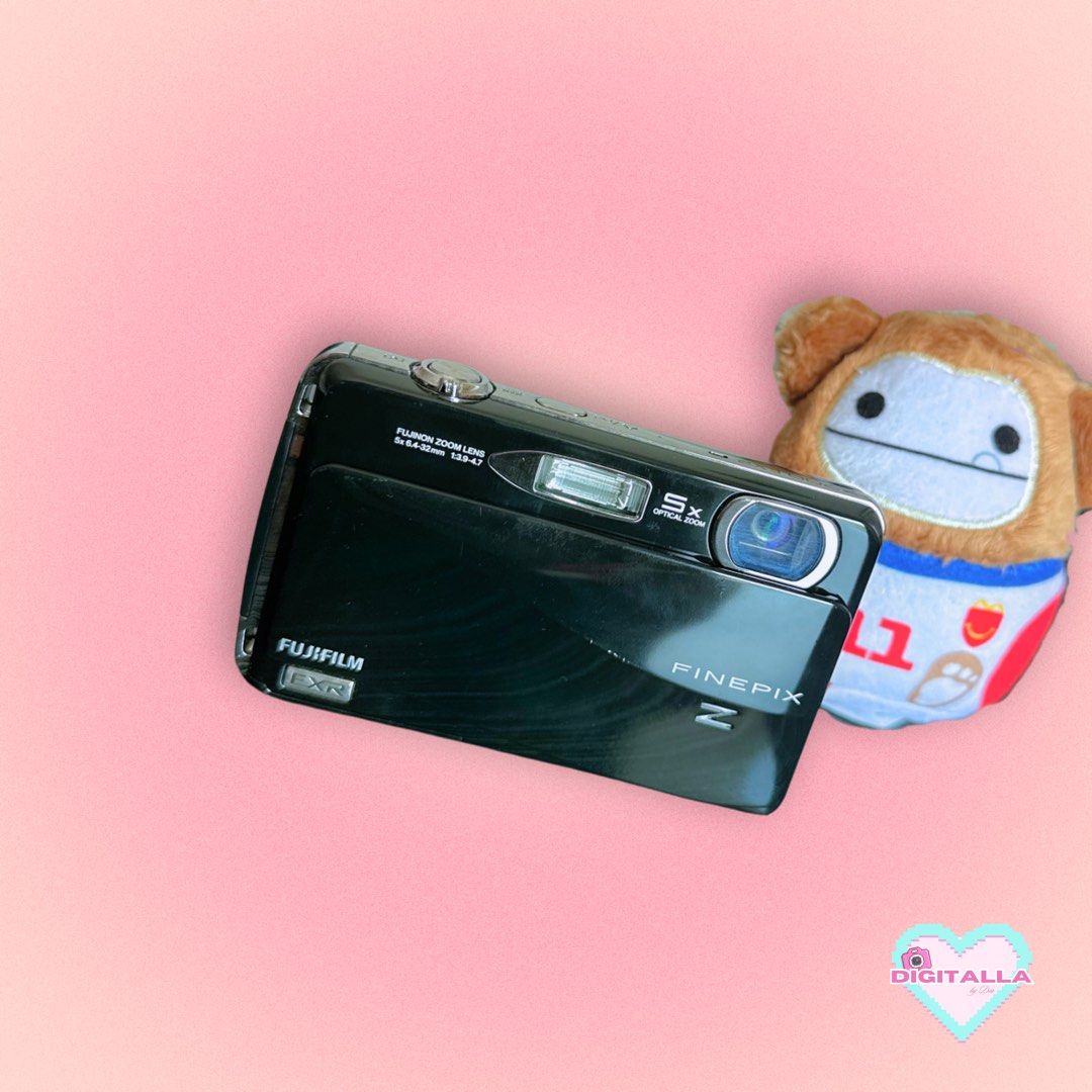 Fujifilm Z700 EXR Digicam Digital Camera (Category: Cameras) located in Iloilo. Submitted by alyssadia (Listing ID 1459660451, Image 2). Description: 𝐅𝐮𝐣𝐢𝐟𝐢𝐥𝐦 𝐅𝐢𝐧𝐞𝐏𝐢𝐱 𝐙𝟕𝟎𝟎 𝐄𝐗𝐑 (𝐁𝐥𝐚𝐜𝐤) ✧･ﾟ🖤📸 ┆ ⤿ 🌸 . ݁˖ 𝐃𝐄𝐓𝐀𝐈𝐋𝐒 ✧ 12MP EXR CMOS Sensor ✧ 5x Optical Zoom Fujinon Lens ✧ 720p HD Video Recording ✧ 3.0” Touchscreen LCD ✧ EXR Auto Mode for Low-Light/HDR Shots ✧ Body Condition: 8.5/10 — slight paint chips ✧ LCD: 9/10, wi