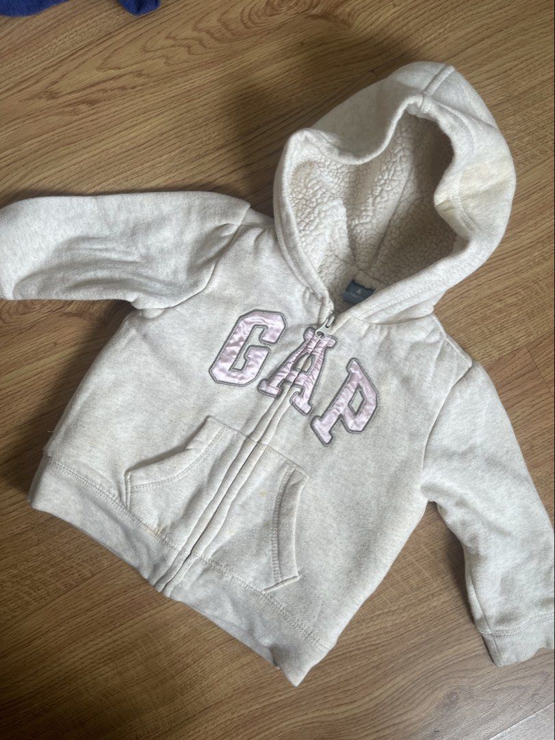 Gap fleece jacket (Category: Babies & Kids Fashion) located in Quezon City. Submitted by booktt (Listing ID 1463818432, Image 1). Description: with stains , not sure if removeable orig bought fr store 12-18m old.