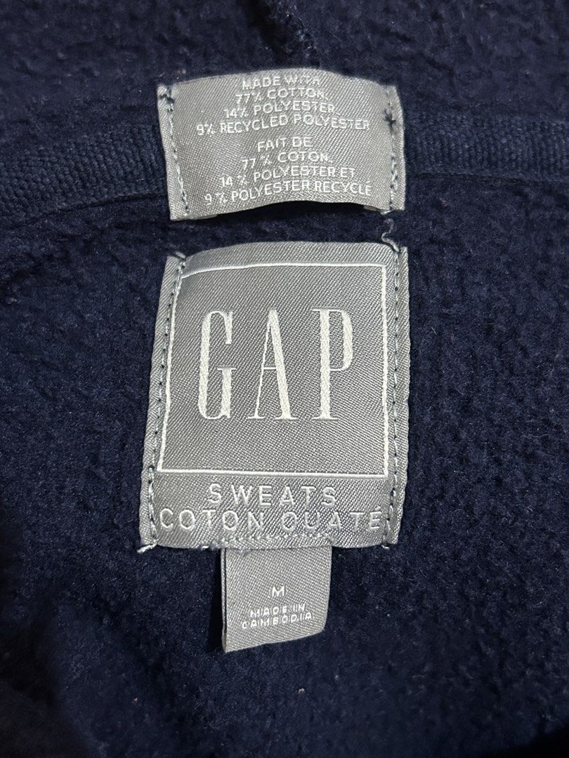GAP Navy Blue Hoodie Sweatshirt (Category: Coats, Jackets and Outerwear) located in Valenzuela. Submitted by everydaysale_deni (Listing ID 1463881203, Image 3). Description: - Iconic white and red GAP logo across the chest - Features a front kangaroo pocket - Ideal for everyday casual wear.