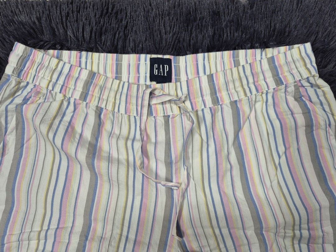 GAP Striped Lounge Pants Size L (Category: Other Bottoms) located in Angeles City. Submitted by gtwear (Listing ID 1463820859, Image 3). Description: - Brand: GAP - Style: Lounge Pants - Design: Pastel stripe pattern - Material: 100% Cotton - Features: Elastic waistband with drawstring - Condition: Brand new with tag attached - Perfect for: Lounging at home or casual wear W: 36-42 L: 39 Hem: 11 mop: gcash loc : pampanga courier: J&T 500+sf DM.