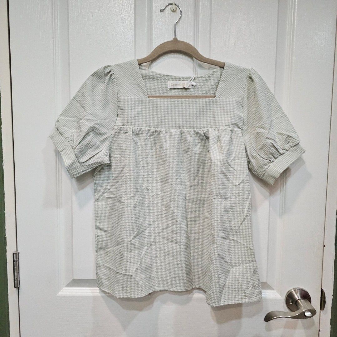 Gingham Square Neck Puff Sleeve Top (Category: Blouses) located in Makati City. Submitted by goldenbird.001 (Listing ID 1463890439, Image 1). Description: - Cute gingham top from Grace & Co. - Features a square neckline and puff sleeves. - Versatile for casual wear or dressing up. - Fabric has a nice, textured feel. - Easy to pair with jeans or skirts..
