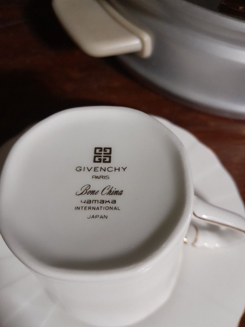 Givenchy Paris Bone China Cup and Saucer Set (Category: Coffee & Tea Tableware) located in San Pedro. Submitted by resa70 (Listing ID 1463755671, Image 1). Description: - Authentic Givenchy Paris white bone china cup and saucer set. - Exquisitely crafted in Japan by Yamaka International. - Features a delicate gold trim on the cup rim and handle. - The saucer proudly displays the Givenchy Paris logo. - A timeless and sophisticated addition to any 