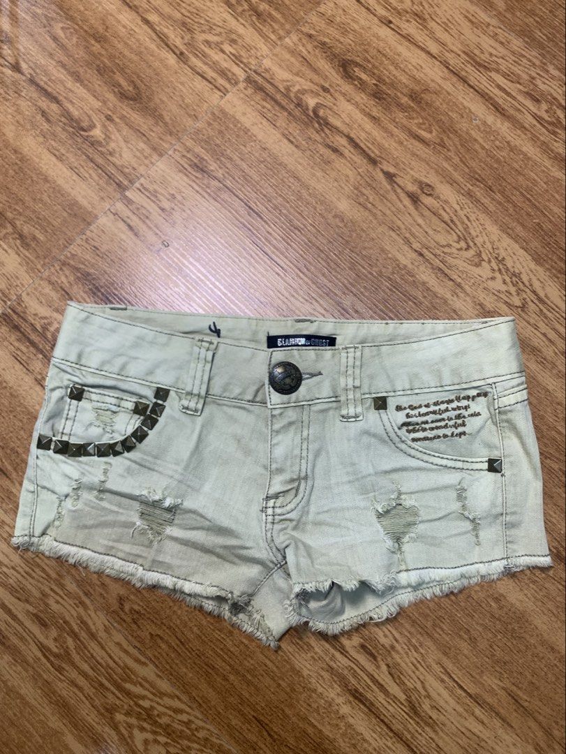 GLAMOUR de GHOST Studded Ripped Denim Shorts (Category: Shorts) located in Davao. Submitted by legitseller1111 (Listing ID 1463783772, Image 1). Description: - Light wash denim shorts -Size 28-29 - Distressed rips for a edgy look - Studded detailing on front and back pockets - Unique 'GHOST' wing graphic on the back - Frayed hemline - Button and zip fly closure .