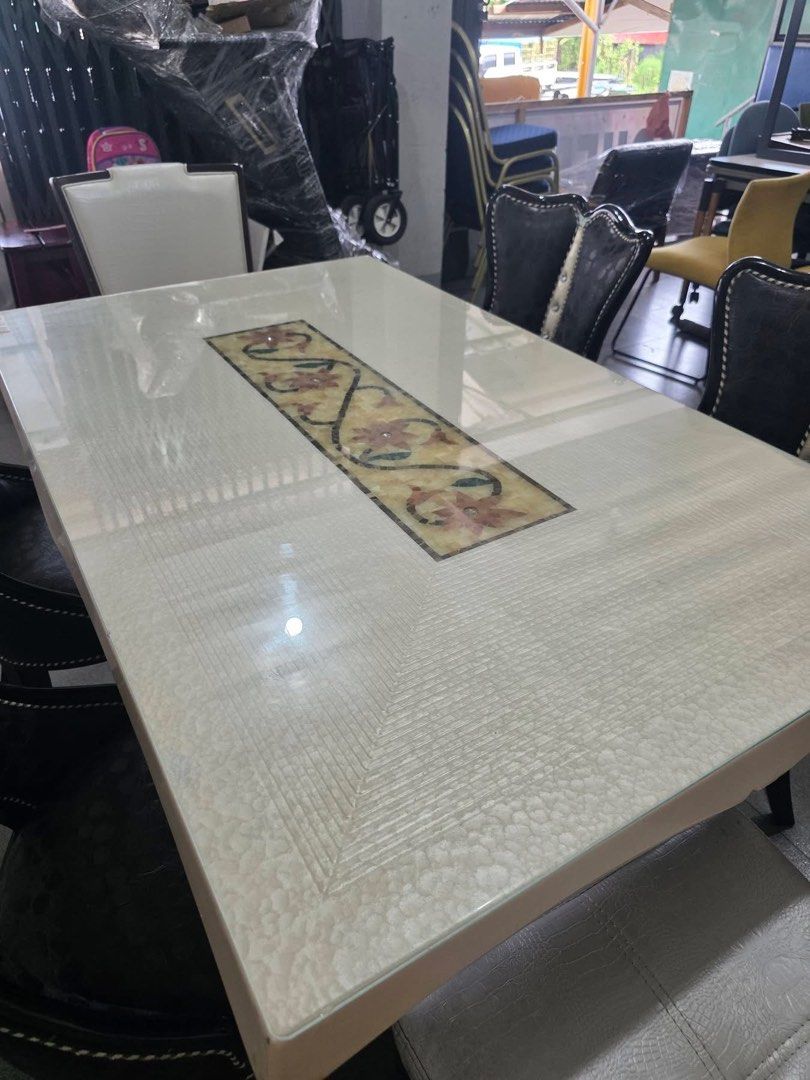 Glass Top Dining Table with 6 Chairs (Category: Tables & Sets) located in Baguio. Submitted by nileh (Listing ID 1463761134, Image 2). Description: DINING SET Japan Surplus New Arrival Marble dining table with glass on top and upholstered table stand frame 6 chairs (upholstered crocodile leather pattern) Good Condition Minor Scratches Dimensions: L-54" W-33" H-31" .