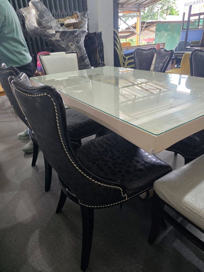Glass Top Dining Table with 6 Chairs (Category: Tables & Sets) located in Baguio. Submitted by nileh (Listing ID 1463761134, Image 3). Description: DINING SET Japan Surplus New Arrival Marble dining table with glass on top and upholstered table stand frame 6 chairs (upholstered crocodile leather pattern) Good Condition Minor Scratches Dimensions: L-54" W-33" H-31" .