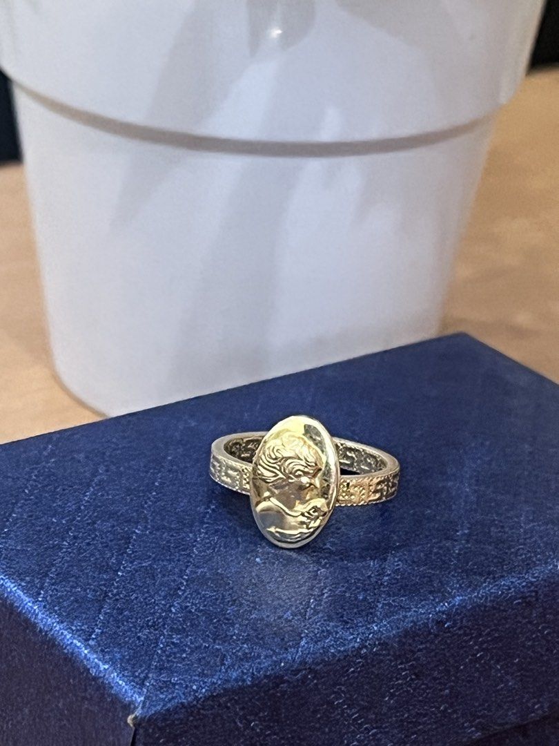 Gold Ring with Oval Cameo Portrait (Category: Rings) located in Manila. Submitted by missyoung222 (Listing ID 1463799046, Image 3). Description: - Elegant gold ring - Features an oval cameo portrait on the face - Band has a textured pattern - Classic, vintage-inspired design - Perfect for adding a timeless touch to any outfit.