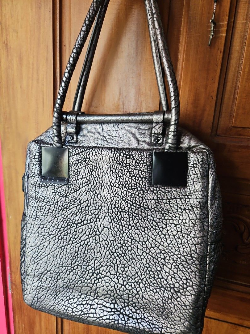 GOOSANGA Metallic Textured Handbag (Category: Luxury Bags & Wallets) located in Tarlac. Submitted by twop.twob (Listing ID 1463935874, Image 1). Description: - Cool metallic textured handbag - Unique crinkled effect on the material - Two top handles - Main zip compartment - Small metal logo plate on the front - Interior zipped pocket - Versatile for everyday use or a night out.