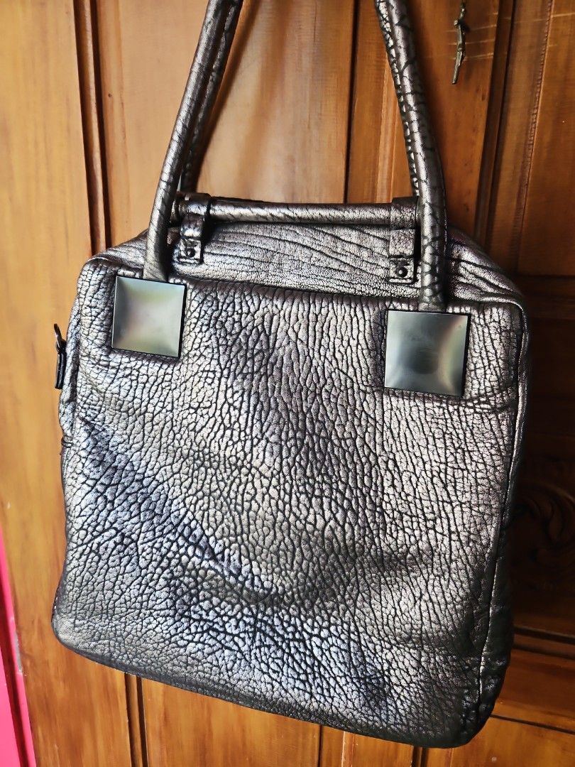 GOOSANGA Metallic Textured Handbag (Category: Luxury Bags & Wallets) located in Tarlac. Submitted by twop.twob (Listing ID 1463935874, Image 3). Description: - Cool metallic textured handbag - Unique crinkled effect on the material - Two top handles - Main zip compartment - Small metal logo plate on the front - Interior zipped pocket - Versatile for everyday use or a night out.