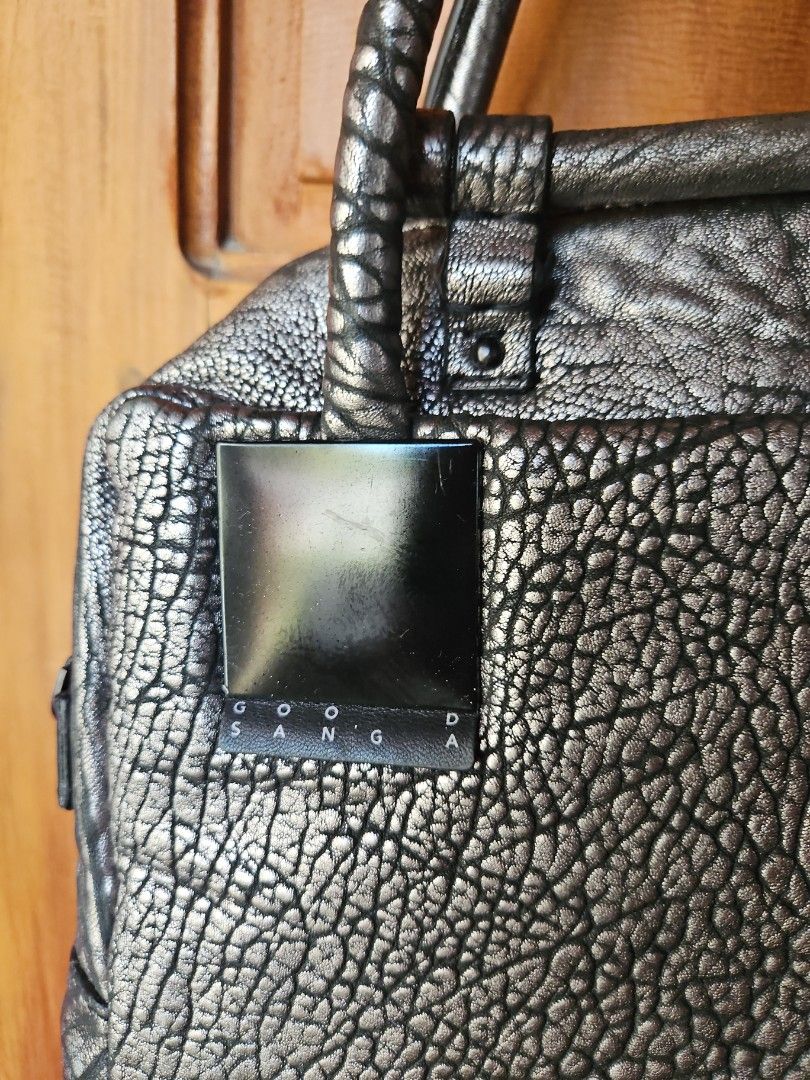 GOOSANGA Metallic Textured Handbag (Category: Luxury Bags & Wallets) located in Tarlac. Submitted by twop.twob (Listing ID 1463935874, Image 2). Description: - Cool metallic textured handbag - Unique crinkled effect on the material - Two top handles - Main zip compartment - Small metal logo plate on the front - Interior zipped pocket - Versatile for everyday use or a night out.