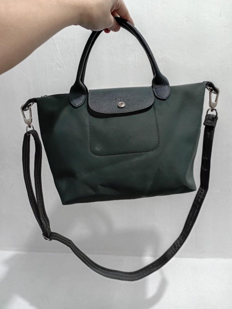 GRAPHITE GREY LONGCHAMP NEO (Category: Luxury Bags & Wallets) located in Manila. Submitted by eriiicaspage (Listing ID 1463849545, Image 1). Description: PREOWNED Lightly Used Authentic Longchamp Pliage Neo Small tote handbag /crossbody Graphite Grey Small - Versatile: top handles and detachable shoulder strap - Secure closures: snap button on flap and interior zipper - Ideal for everyday use Min Sign of Used Good Condition 9/10.
