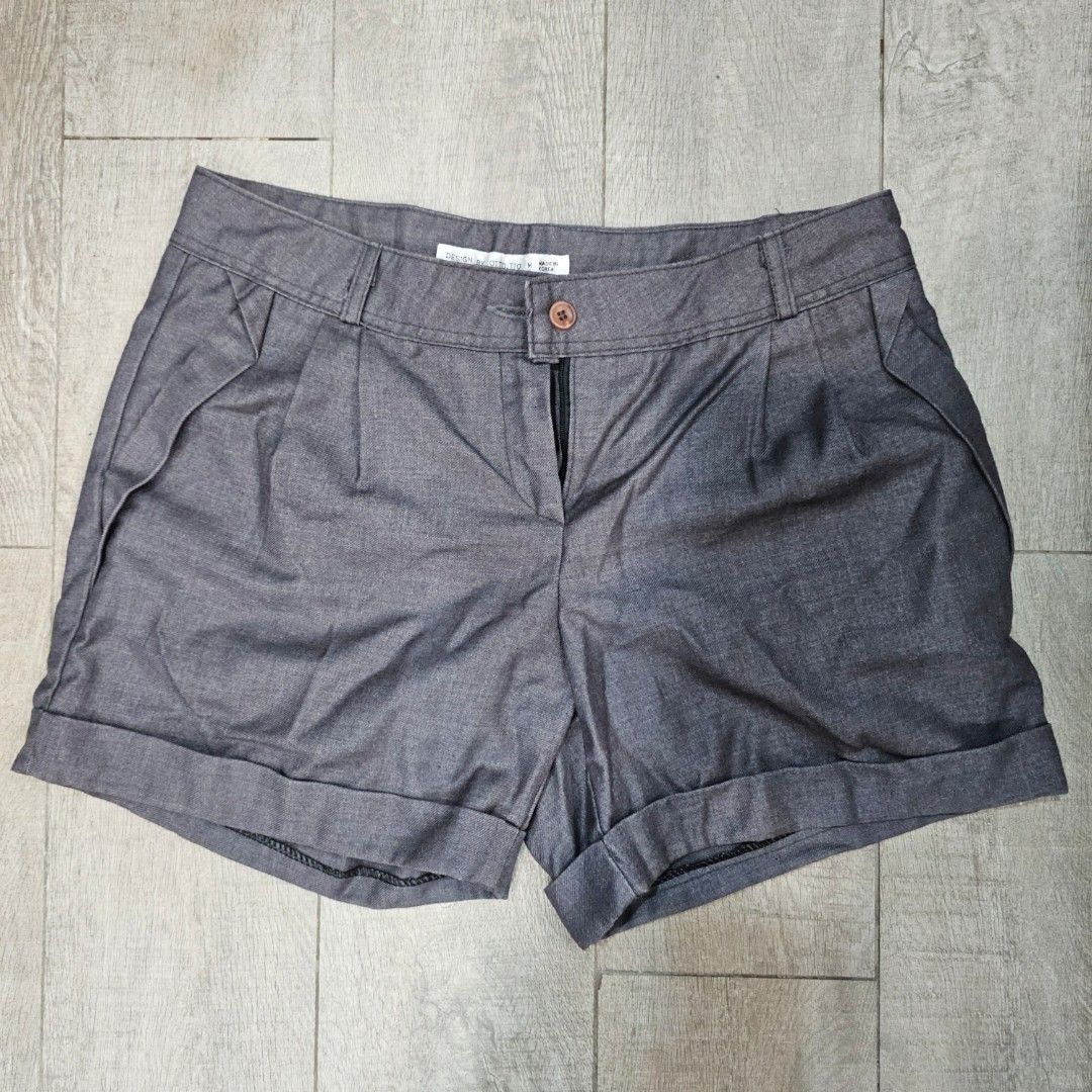 Grey Cuffed Shorts (Category: Shorts) located in Makati City. Submitted by goldenbird.001 (Listing ID 1463866967, Image 1). Description: - Grey shorts with a stylish cuffed hem. - Features a secure button and zip closure. - Elegant front pleats for a polished look. - Ideal for everyday casual wear..
