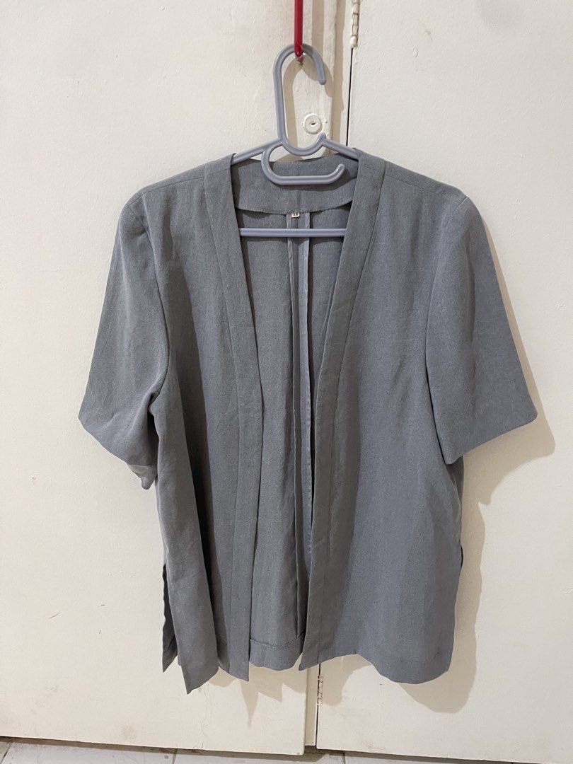 Grey Short Sleeve Open Front Cardigan (Category: Blouses) located in Quezon City. Submitted by kim_ooooo (Listing ID 1463906274, Image 1). Description: - Grey short sleeve cardigan - Open front style - Lightweight material, ideal for layering - Relaxed fit - Simple and versatile piece.