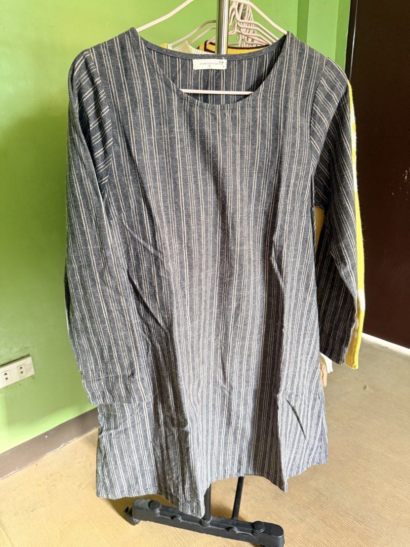 Grey Striped Long Sleeve Dress (Category: Longsleeves) located in Muntinlupa City. Submitted by cocofinds023 (Listing ID 1463749994, Image 1). Description: - Grey dress with subtle thin white vertical stripes. - Features long sleeves for a comfortable fit. - Two small, functional pockets on the front. - Made from a fabric that resembles a linen blend. - Ideal for everyday casual wear..