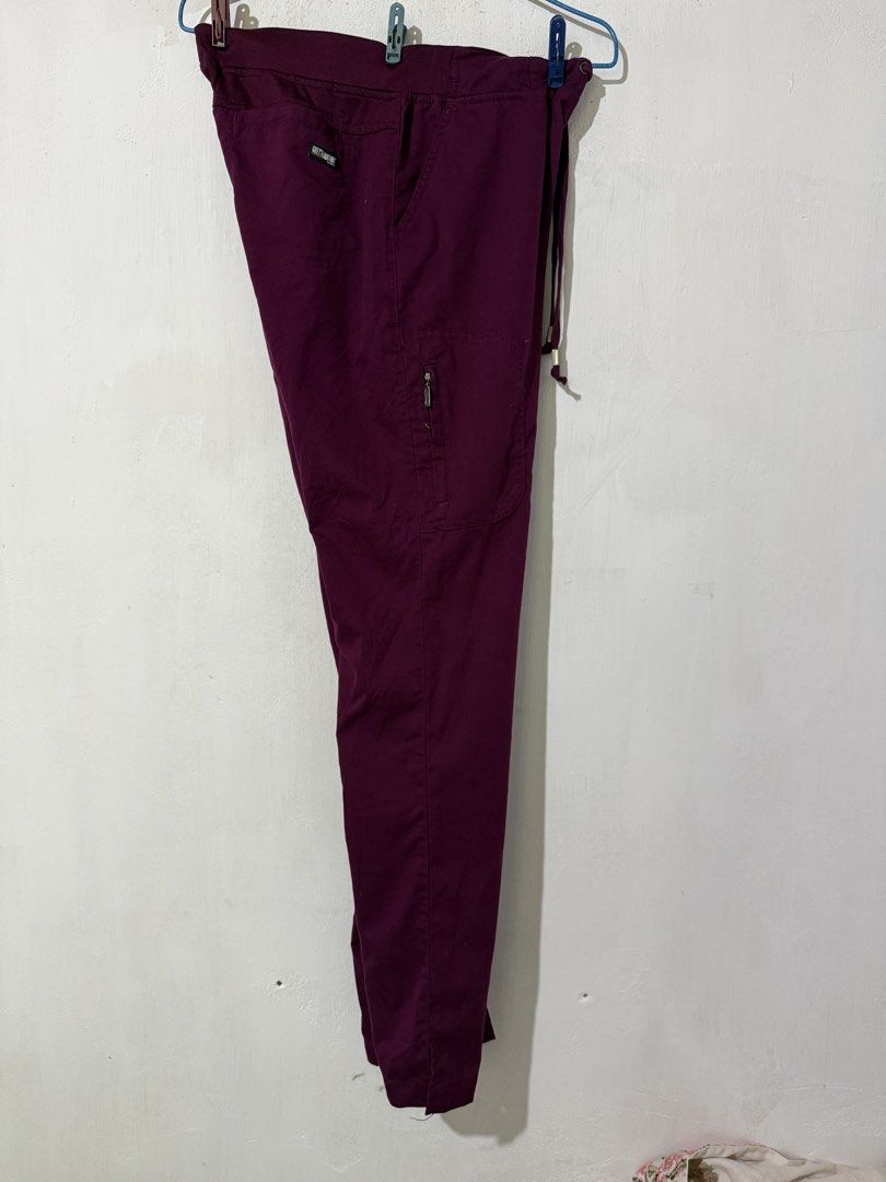 Grey's Anatomy Scrub Pants Burgundy Cargo Drawstring (Category: Activewear) located in Tuguegarao City. Submitted by janurtist (Listing ID 1463744178, Image 2). Description: - Burgundy cargo scrub pants - Brand: Grey's Anatomy - Small on tag - Comfortable elastic waistband with drawstring - Multiple pockets, including a secure side zip pocket - Classic straight leg style - Ideal for work or casual wear Selling price: 950 SF not included Loc: Abul