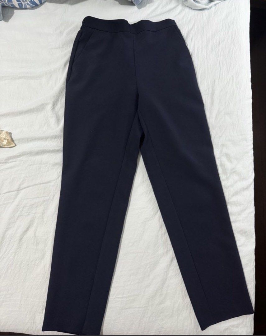 GU Stretch Ankle Pants Navy Blue (Category: Other Bottoms) located in Manila. Submitted by goodthingspreloved.92 (Listing ID 1463886033, Image 2). Description: - Navy blue ankle pants from GU - Comfortable elastic waistband - Features functional pockets - Ankle length design - Versatile for casual outings or work attire - Easy to style for various looks.