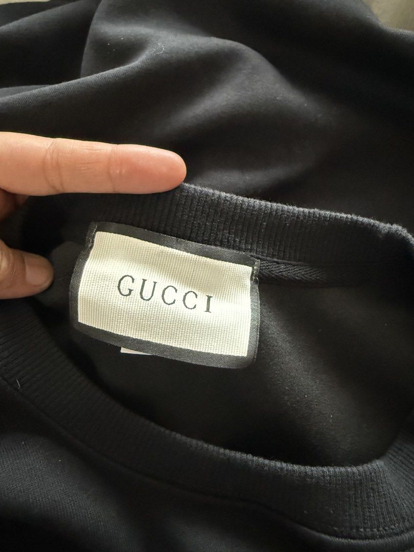 Gucci Black Sweatshirt with Logo (Category: Coats, Jackets and Outerwear) located in Cabuyao City. Submitted by arral (Listing ID 1463789181, Image 3). Description: - Authentic Gucci sweatshirt - Iconic Gucci logo across the chest - Size L (175/92A) Womens - Made in China - Ideal for casual wear - Please check photos for detailed condition.