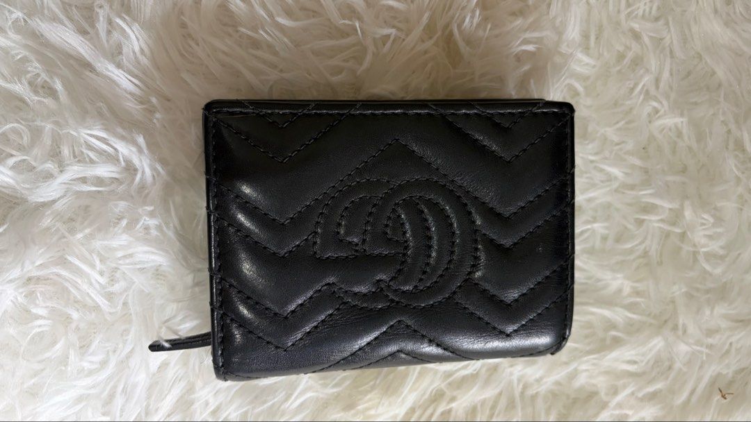 Gucci Marmont Wallet Black Leather (Category: Luxury Bags & Wallets) located in Dumaguete. Submitted by freshcornerbyyeng (Listing ID 1463786715, Image 2). Description: - Authentic black leather Gucci wallet - Iconic GG logo hardware - Stylish quilted chevron pattern - Compact bifold design - Ample card slots and coin pocket - Perfect for daily use - Shows some signs of wear on edges and corners -no box no inclusion -wallet only.