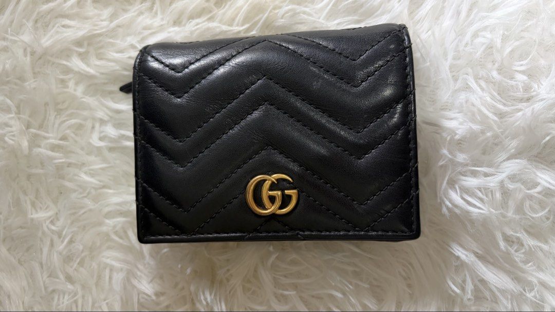 Gucci Marmont Wallet Black Leather (Category: Luxury Bags & Wallets) located in Dumaguete. Submitted by freshcornerbyyeng (Listing ID 1463786715, Image 1). Description: - Authentic black leather Gucci wallet - Iconic GG logo hardware - Stylish quilted chevron pattern - Compact bifold design - Ample card slots and coin pocket - Perfect for daily use - Shows some signs of wear on edges and corners -no box no inclusion -wallet only.