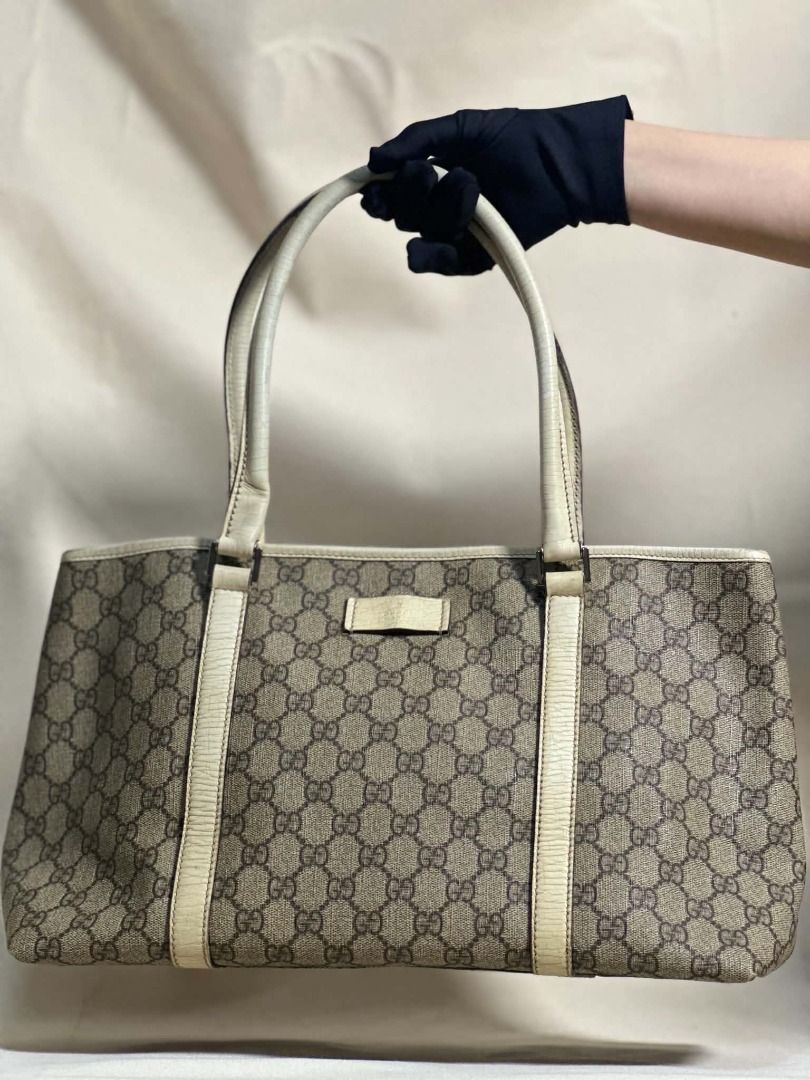 Gucci Supreme Joy Tote Bag (Category: Luxury Bags & Wallets) located in Caloocan City. Submitted by anewchapterluxx (Listing ID 1463772457, Image 1). Description: INCLUSIONS: - certificate of authenticity - dust bag CONDITION: B Rank 7/10 (Well used) - Classic Gucci monogram canvas handbag - Beige and brown GG pattern - Leather trim and details - Clean interior - Minor signs of wear on exterior leather trim - Authentic guaranteed.