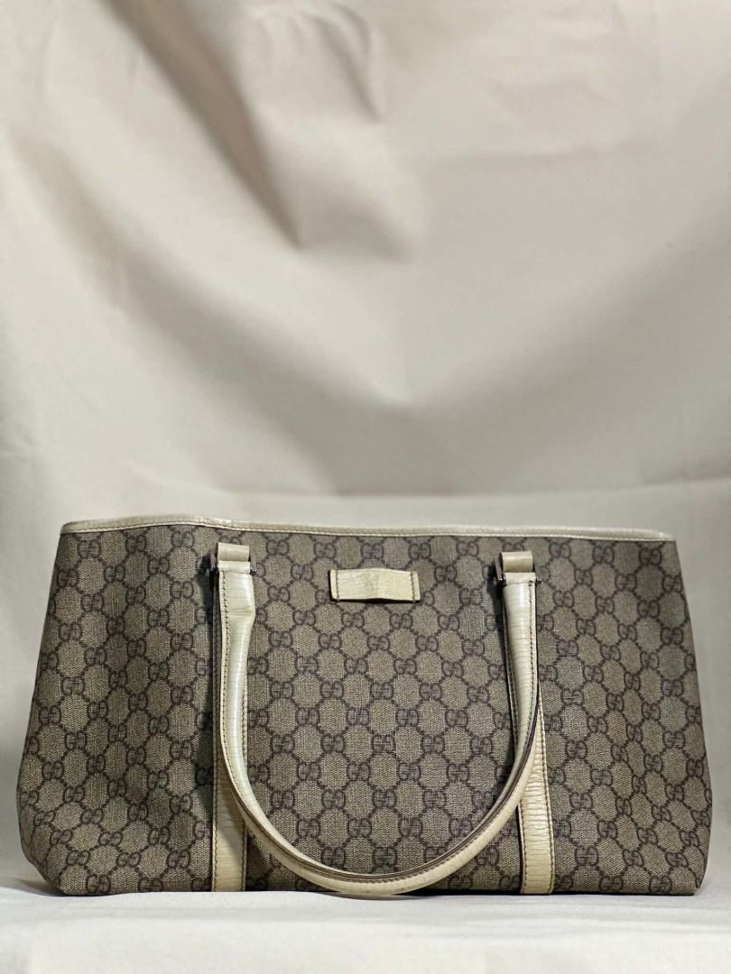 Gucci Supreme Joy Tote Bag (Category: Luxury Bags & Wallets) located in Caloocan City. Submitted by anewchapterluxx (Listing ID 1463772457, Image 2). Description: INCLUSIONS: - certificate of authenticity - dust bag CONDITION: B Rank 7/10 (Well used) - Classic Gucci monogram canvas handbag - Beige and brown GG pattern - Leather trim and details - Clean interior - Minor signs of wear on exterior leather trim - Authentic guaranteed.