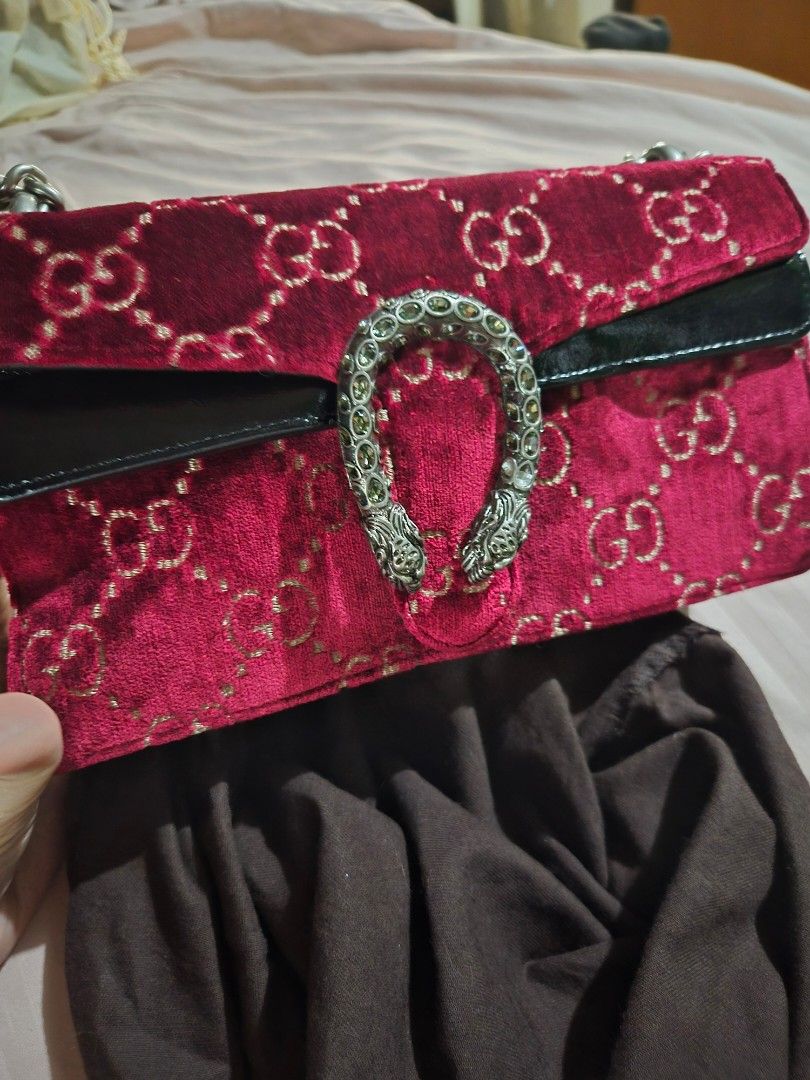 Gucci Velvet Dionysus Bag (Category: Luxury Bags & Wallets) located in Manila. Submitted by maica_29 (Listing ID 1463883090, Image 1). Description: - Authentic Red Velvet Gucci Bag - Features the signature GG pattern - Adorned with the iconic Dionysus tiger head closure - Silver chain strap - Comes with a dark brown dust bag.