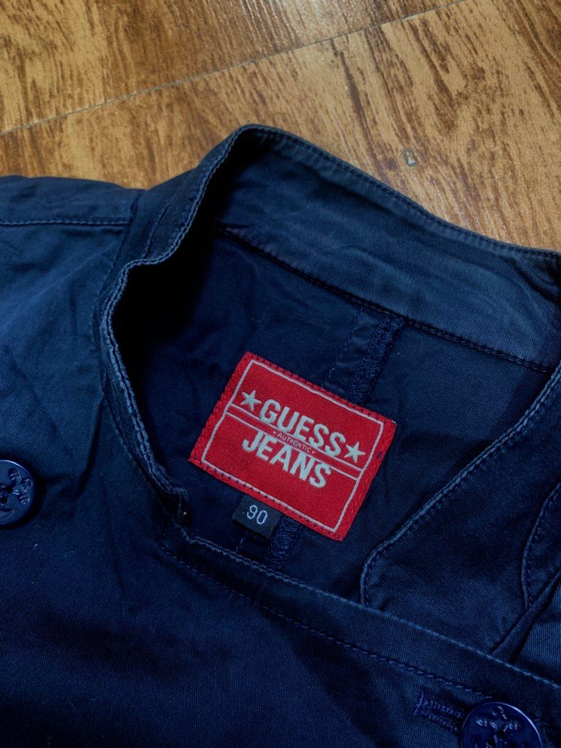 Guess Jeans Double Breasted Navy Jacket Size 90 (Category: Coats, Jackets and Outerwear) located in Davao. Submitted by legitseller1111 (Listing ID 1463784374, Image 3). Description: - Navy blue Guess Jeans jacket - Double-breasted style with button closure - Features a collar and two front pockets - Made in Korea - Tag size: 90.