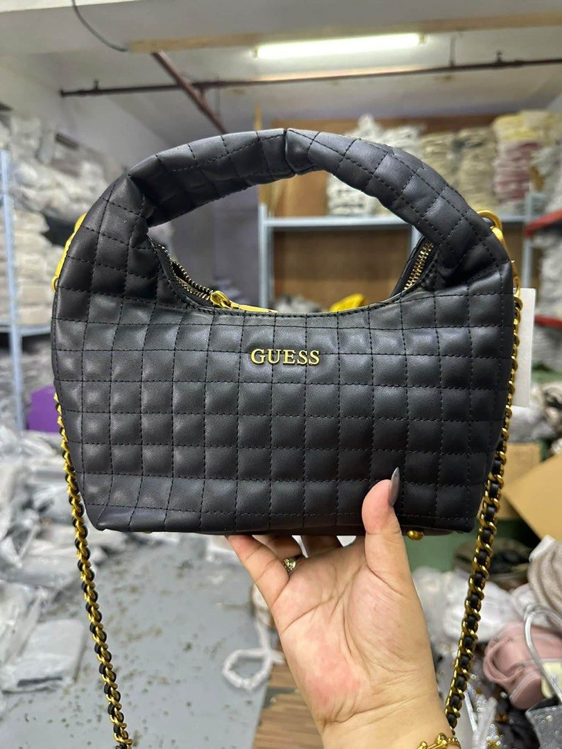 Guess Quilted Chain Shoulder Bag (Category: Shoulder Bags) located in Taguig. Submitted by roseanneramirez (Listing ID 1463831345, Image 3). Description: - Stylish Guess handbag - Gold chain strap - Quilted design - Available in black and beige - Versatile for day or night use - Spacious enough for your essentials - Comes with a dust bag.