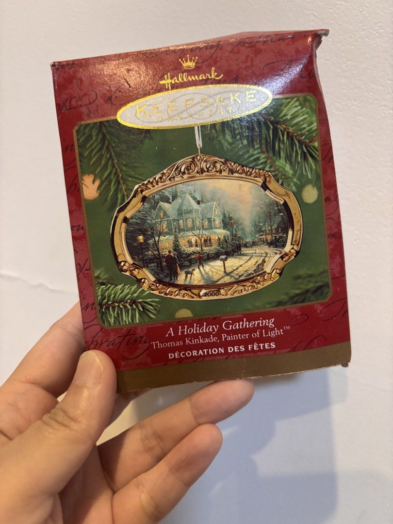 Hallmark Keepsake Ornament - A Holiday Gathering 2000 (Category: Vintage Collectibles) located in Quezon City. Submitted by onlinebazaare (Listing ID 1463750247, Image 1). Description: - Hallmark Keepsake Ornament - Year: 2000 - Title: 'A Holiday Gathering' - Artist: Thomas Kinkade - Features: Snowy house scene with people and cars - Condition: Comes in original box - Ideal for: Collectors and holiday decoration.