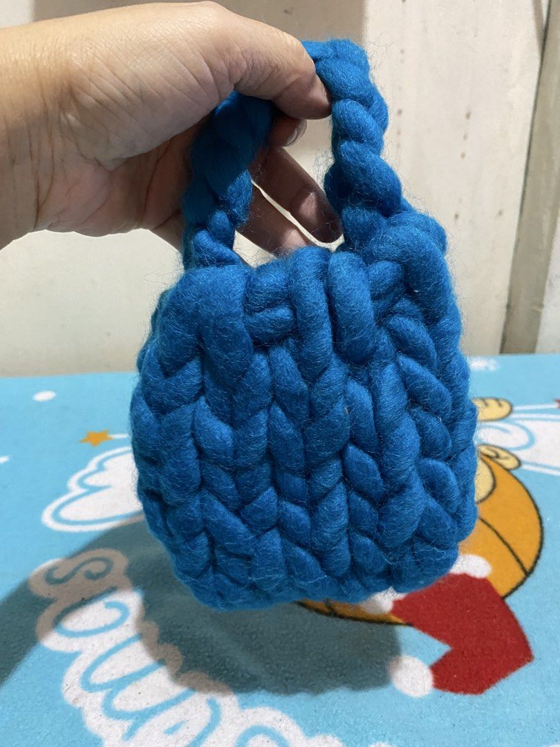 Handmade Blue Knitted Bag with Braided Handle (Category: Shoulder Bags) located in Manila. Submitted by resi.diaz (Listing ID 1463821578, Image 2). Description: - 5 x 5 inches - Adorable blue knitted bag - Crafted with chunky yarn - Features a stylish braided handle - Perfect size for keys, coins, or other small items - Makes a thoughtful gift or a lovely personal treat - Lovingly handmade with care.