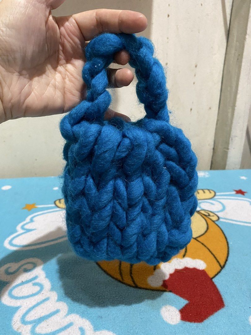 Handmade Blue Knitted Bag with Braided Handle (Category: Shoulder Bags) located in Manila. Submitted by resi.diaz (Listing ID 1463821578, Image 1). Description: - 5 x 5 inches - Adorable blue knitted bag - Crafted with chunky yarn - Features a stylish braided handle - Perfect size for keys, coins, or other small items - Makes a thoughtful gift or a lovely personal treat - Lovingly handmade with care.
