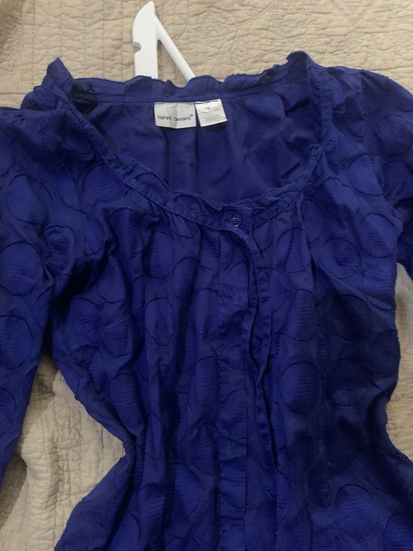 Harve Benard Blue Textured Button-Up Blouse (Category: Blouses) located in Manila. Submitted by spaceshop12345 (Listing ID 1463806971, Image 2). Description: - Blue long-sleeve blouse from Harve Benard - Features a unique textured circle pattern all over - Button-up front for adjustable styling - Elegant ruffled neckline adds a feminine touch - Ruffled cuffs on the sleeves for added detail - Perfect for pairing with jeans or skirts - Suitable for