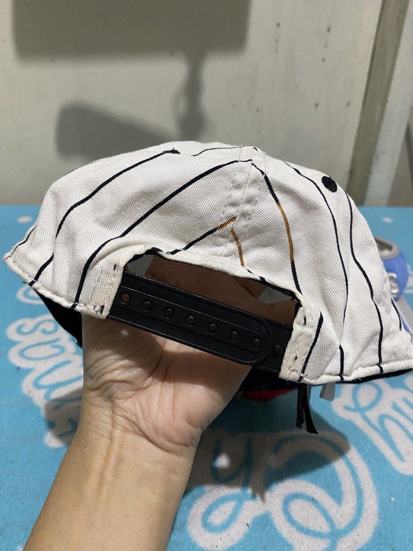 H&M LA Cap & Yankees Visor Bundle (Category: Babies & Kids Fashion) located in Manila. Submitted by resi.diaz (Listing ID 1463838050, Image 3). Description: - 6-8 years old - Bundle includes 2 headwear items: - H&M Cap: White with black pinstripes, 'LA' design, black brim, adjustable strap. - New York Yankees Visor: Blue and grey colorway. - Both are great for casual outings or showing team spirit..
