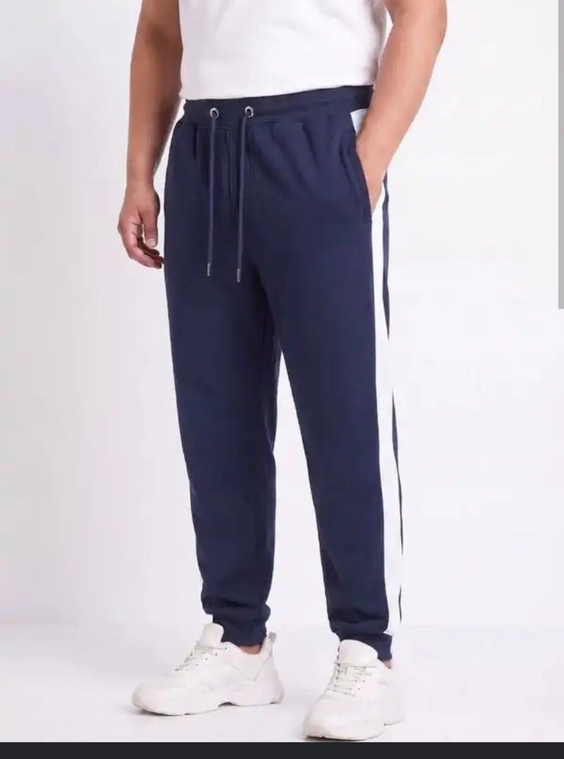 H&M Navy Blue Joggers with White Side Stripe (Category: Joggers) located in Manila. Submitted by PrinceDani.Clothing (Listing ID 1463816550, Image 1). Description: h&m jogger navy blue large fit 34in waist 39in length issue: lints excellent condition .