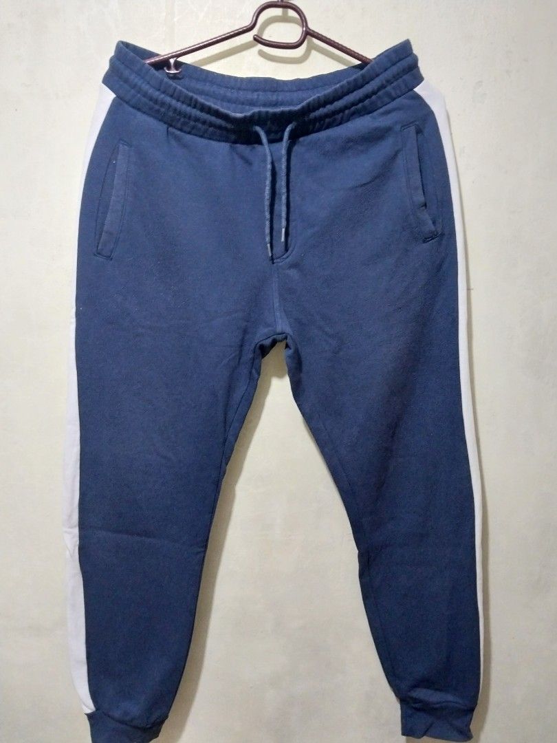 H&M Navy Blue Joggers with White Side Stripe (Category: Joggers) located in Manila. Submitted by PrinceDani.Clothing (Listing ID 1463816550, Image 2). Description: h&m jogger navy blue large fit 34in waist 39in length issue: lints excellent condition .