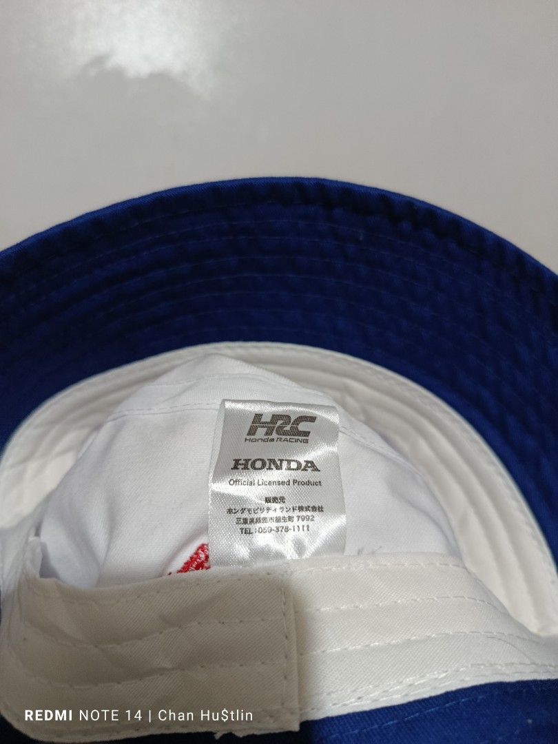 Honda Racing HRC Bucket Hat (Category: Caps & Hats) located in Calamba. Submitted by chanmagpantay (Listing ID 1463747483, Image 3). Description: - Official licensed Honda Racing HRC bucket hat - Classic white and blue design - Features prominent Honda Racing HRC logo - Additional Honda logo detail on the side - Ideal for sunny weather protection - A must-have for any Honda enthusiast.