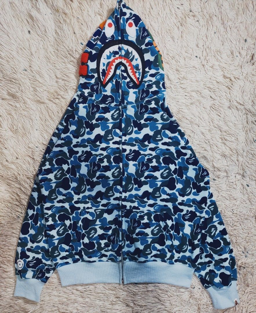 Hoodie jacket (Category: Hoodies) located in Hermosa. Submitted by angelo_12 (Listing ID 1463937821, Image 1). Description: Bape ABC Camo Shark Full Zip Hoodie ( Blue ) Dimes 23W / 28L ( Best Fit For Large ) Colour Rate 10/10 No ISSUES yan! Like New Condition Ready To Wear, Nalaban na 1500 Negotiable SA price.