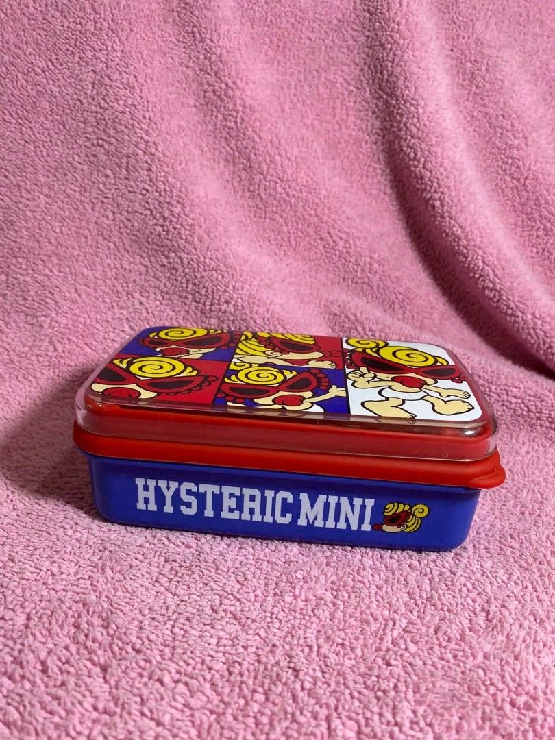 Hysteric Mini Lunch Box Container Japan (Category: Food Organization & Storage) located in Valenzuela. Submitted by rooooons (Listing ID 1463832487, Image 2). Description: - Adorable Hysteric Mini container - Fun cartoon print on the lid - Blue base with Hysteric Mini logo - Ideal for snacks or organizing small items - Made in Japan - Dimensions: 15cm x 10cm x 5cm.