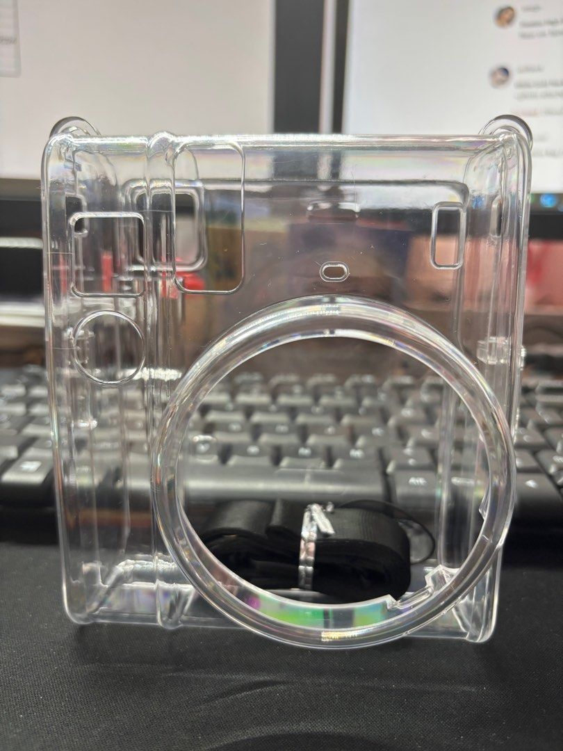 Instax Mini 40 Crystal Clear Camera Case / Bag with Strap (Category: Camera Bags & Carriers) located in Quezon City. Submitted by garagesale2026 (Listing ID 1463865752, Image 2). Description: - Never used - Transparent protective case for your camera - Includes a black strap - Shields your camera from scratches and bumps - Simple to attach and remove.
