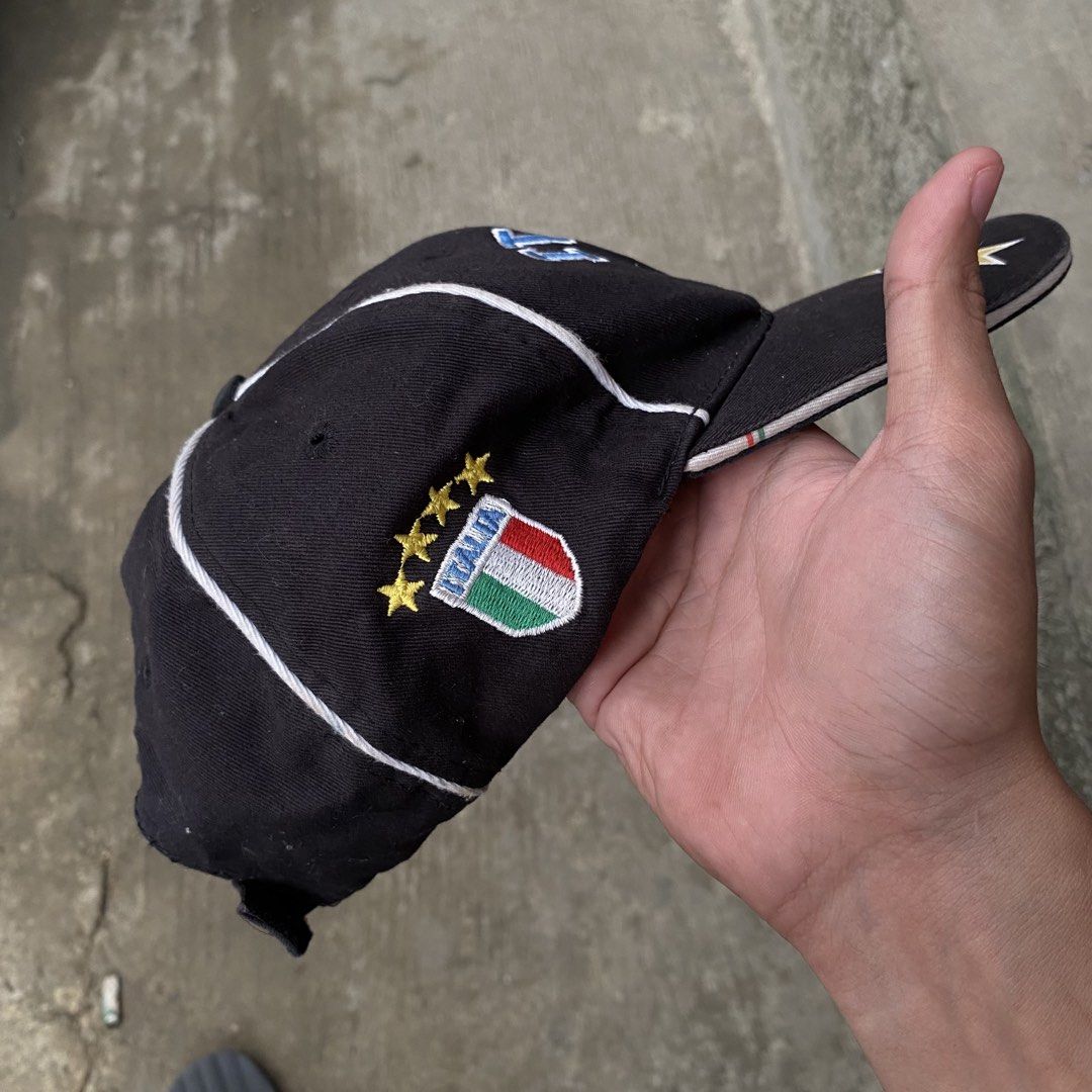 Italia Embroidered Baseball Cap (Category: Caps & Hats) located in Catbalogan. Submitted by thrifttoheaven13 (Listing ID 1463830277, Image 3). Description: - Black baseball cap with 'ITALIA' embroidery on front and back. - Features Italian flag crest and multiple stars. - Material: 100% Cotton. - Made in China. - Adjustable strap for a comfortable fit. - Ideal for football fans and everyday casual wear..