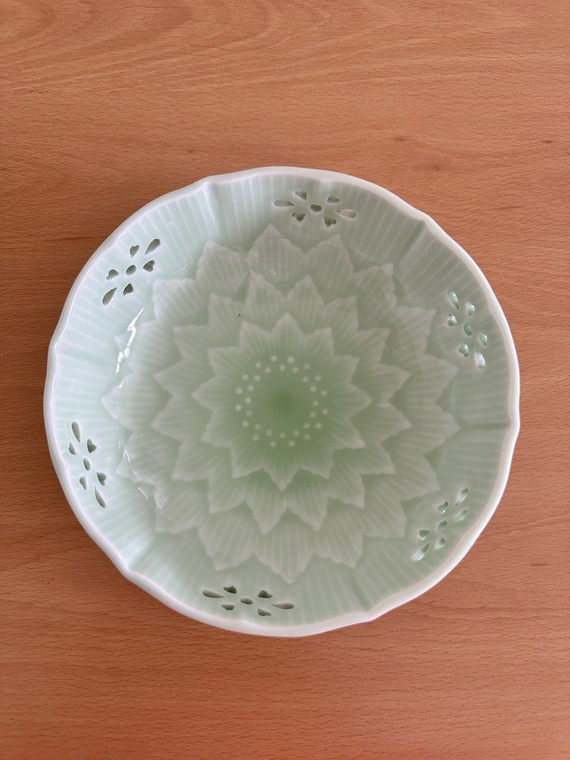 Japan Arita ware small bowl (Category: Vases & Decorative Bowls) located in Paranaque City. Submitted by seektoshop (Listing ID 1463743796, Image 1). Description: Light Green Ceramic Bowl with Floral Cutouts and Embossed Design ✔️ Authentic Japanese ware ✔️ Celadon glazed reticulated small bowl ✔️ featuring a delicate flower-shaped cutout design ✔️ Ideal for serving snacks or as a decorative piece ✔️ Approximately 6 inches in diameter.