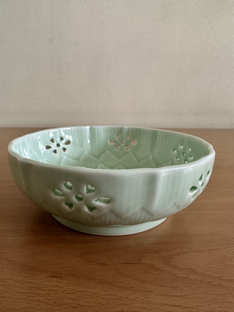Japan Arita ware small bowl (Category: Vases & Decorative Bowls) located in Paranaque City. Submitted by seektoshop (Listing ID 1463743796, Image 2). Description: Light Green Ceramic Bowl with Floral Cutouts and Embossed Design ✔️ Authentic Japanese ware ✔️ Celadon glazed reticulated small bowl ✔️ featuring a delicate flower-shaped cutout design ✔️ Ideal for serving snacks or as a decorative piece ✔️ Approximately 6 inches in diameter.