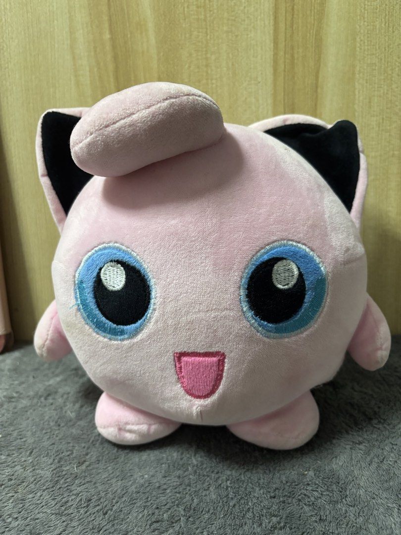 Jigglypuff Pokemon Plush Toy (Category: Plushies & Soft Toys) located in Pasig City. Submitted by genyzk (Listing ID 1463811664, Image 1). Description: - Adorable pink Jigglypuff plush toy. - Features blue eyes and black ears. - Approximately the size of a softball. - Still very soft and huggable. - A must-have for any Pokemon enthusiast..