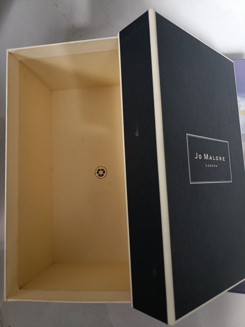 Jo Malone London Gift Box (Category: Fragrance & Deodorants) located in Paranaque City. Submitted by ascendhomeware (Listing ID 1463753934, Image 2). Description: - Authentic Jo Malone London gift box - Elegant black exterior with signature gold lettering - Luxurious cream interior lining - Complete with lid - Ideal for storing small treasures or as a chic display piece -BOX ONLY .